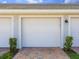 Attached garage with brick paver driveway and manicured landscaping enhances the curb appeal at 14214 Heritage Landing Blvd # 817, Punta Gorda, FL 33955