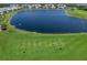 Aerial view of the golf course with practice tee area at 14214 Heritage Landing Blvd # 817, Punta Gorda, FL 33955