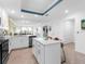 Spacious kitchen featuring a large island with seating, leading into the adjacent living spaces at 14214 Heritage Landing Blvd # 817, Punta Gorda, FL 33955