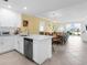Bright kitchen featuring stainless steel appliances and an open layout to the dining and living areas at 14214 Heritage Landing Blvd # 817, Punta Gorda, FL 33955
