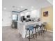 Modern kitchen with white cabinets, stainless steel appliances, and bar seating, perfect for entertaining at 14214 Heritage Landing Blvd # 817, Punta Gorda, FL 33955