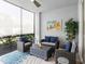 Inviting lanai featuring wicker furniture and tropical decor, perfect for outdoor living and entertaining at 14214 Heritage Landing Blvd # 817, Punta Gorda, FL 33955