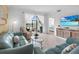 Cozy living room showcasing water views, comfortable seating, and a modern media cabinet at 14214 Heritage Landing Blvd # 817, Punta Gorda, FL 33955