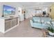 Open living room features a media center, comfortable seating, and an adjacent dining space at 14214 Heritage Landing Blvd # 817, Punta Gorda, FL 33955