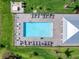 Aerial shot of the community pool, showcasing lounge chairs and lush landscaping at 14214 Heritage Landing Blvd # 817, Punta Gorda, FL 33955