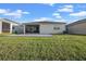 Expansive backyard with lush grass and paver patio, perfect for outdoor living at 14444 59Th E Cir, Bradenton, FL 34211