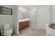 Bathroom featuring a double vanity, shower, and toilet at 14444 59Th E Cir, Bradenton, FL 34211
