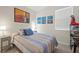 Cozy bedroom with a comfortable bed, side table and modern decor at 14444 59Th E Cir, Bradenton, FL 34211