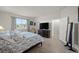 Spacious bedroom with tile flooring, large window, and ensuite bathroom at 14444 59Th E Cir, Bradenton, FL 34211