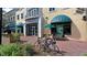 University of South Florida building with awnings, brick pathway, and seating for outdoor gatherings at 14444 59Th E Cir, Bradenton, FL 34211