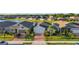 Serene water view homes; lush lawns, and brick driveways in a peaceful community at 14444 59Th E Cir, Bradenton, FL 34211