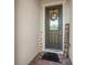 Charming entrance adorned with a wreath, a welcome mat, and inviting decor at 14444 59Th E Cir, Bradenton, FL 34211