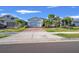 Attractive single-story home with brick drive, lush landscaping, and two-car garage nestled in the community at 14444 59Th E Cir, Bradenton, FL 34211