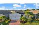 Charming single-story home with a two-car garage, beautiful landscaping, and a brick paved driveway at 14444 59Th E Cir, Bradenton, FL 34211