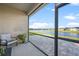 Relaxing screened lanai with tranquil lake views and comfortable seating at 14444 59Th E Cir, Bradenton, FL 34211