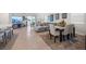 Open-concept living room with tile floors, modern furniture, and a view of the outdoor space at 14444 59Th E Cir, Bradenton, FL 34211