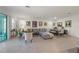 Open-concept living and dining area filled with natural light and stylish decor at 14444 59Th E Cir, Bradenton, FL 34211