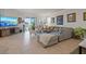 Bright living room with a large sectional sofa, sliding doors, and contemporary furnishings and decor at 14444 59Th E Cir, Bradenton, FL 34211