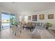 Spacious living room with a large sectional sofa, and sliding glass doors leading to the outdoors at 14444 59Th E Cir, Bradenton, FL 34211