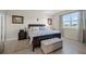 Cozy main bedroom with a large window and comfortable furnishings at 14444 59Th E Cir, Bradenton, FL 34211