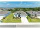 An aerial view of the house with beautiful landscaping, showcasing the neighborhood's serene environment at 16109 6Th E Ave, Bradenton, FL 34212