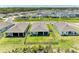 Aerial view of a community showcasing well-maintained lawns and the surrounding neighborhood landscape at 16109 6Th E Ave, Bradenton, FL 34212