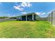 Expansive backyard features a screened-in lanai, providing a perfect space for outdoor relaxation and entertainment at 16109 6Th E Ave, Bradenton, FL 34212