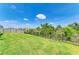 The backyard is lined with a fence with views of the natural landscape at 16109 6Th E Ave, Bradenton, FL 34212