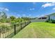 Secluded backyard features a fence line, offering privacy and views of the adjacent natural preserve at 16109 6Th E Ave, Bradenton, FL 34212