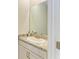 Bathroom featuring a granite countertop vanity with white cabinets offers a clean and modern design at 16109 6Th E Ave, Bradenton, FL 34212