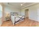 Cozy bedroom with a ceiling fan, wood floors, and two windows for natural light at 16109 6Th E Ave, Bradenton, FL 34212