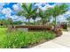 Community entrance sign surrounded by lush landscaping, offering a welcoming first impression at 16109 6Th E Ave, Bradenton, FL 34212