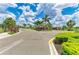 Well-manicured community entrance with tropical landscaping and a gated entry providing security and curb appeal at 16109 6Th E Ave, Bradenton, FL 34212