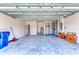 Spacious two-car garage featuring ample storage shelving, sink, and utility area at 16109 6Th E Ave, Bradenton, FL 34212