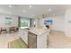 Spacious kitchen island with granite countertops, stainless steel appliances, and barstool seating, perfect for entertaining at 16109 6Th E Ave, Bradenton, FL 34212