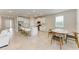 Bright kitchen features white cabinets, stainless steel appliances, granite countertops, and a kitchen island with seating at 16109 6Th E Ave, Bradenton, FL 34212