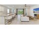 Open-concept living space seamlessly blends the kitchen, dining, and living areas with backyard access at 16109 6Th E Ave, Bradenton, FL 34212