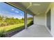Relaxing screened patio overlooking a well-maintained backyard with green grass at 16109 6Th E Ave, Bradenton, FL 34212