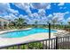Inviting community pool with lounge chairs surrounded by lush landscaping, perfect for relaxation and recreation at 16109 6Th E Ave, Bradenton, FL 34212