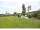 Expansive backyard featuring a lush lawn and pool area, perfect for outdoor activities and entertaining guests at 1731 Redwood St, Sarasota, FL 34231