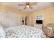 Cozy bedroom featuring a ceiling fan, closet, and nautical themed decor, creating a relaxing coastal atmosphere at 1731 Redwood St, Sarasota, FL 34231
