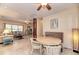 Well-lit dining area with tile floors, booth seating, round table, and open access to living space at 1731 Redwood St, Sarasota, FL 34231