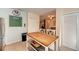 Bright kitchen features stainless appliances, granite counters, tile backsplash, and a center island with seating at 1731 Redwood St, Sarasota, FL 34231