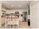 Bright kitchen features stainless appliances, granite counters, tile backsplash, and a center island with seating at 1731 Redwood St, Sarasota, FL 34231