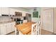 Bright kitchen features stainless appliances, granite counters, tile backsplash, and a center island with seating at 1731 Redwood St, Sarasota, FL 34231