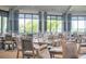 Elegant dining room featuring ample seating and picturesque views through large windows at 17510 Gawthrop Dr # 206, Bradenton, FL 34211