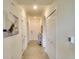 Bright hallway featuring neutral colors and decorative art leading to other rooms in the home at 17510 Gawthrop Dr # 206, Bradenton, FL 34211