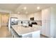Spacious kitchen with white cabinets, a large island, and stainless steel appliances at 17510 Gawthrop Dr # 206, Bradenton, FL 34211