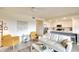 Open-concept living room flowing into a modern kitchen with stainless steel appliances and a large island at 17510 Gawthrop Dr # 206, Bradenton, FL 34211