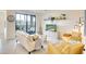 Bright living room with a sliding glass door to the lanai offering comfortable seating and modern décor at 17510 Gawthrop Dr # 206, Bradenton, FL 34211